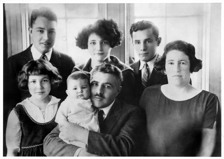 Photograph of Harvey Shonen’s maternal grandparents and of their five children, taken in 1923 according to Harvey. They changed their surname to Strauss in the US. Front row from left: Ethel Strauss, approximately 10 years old (married named Ethel Roifer); Bessie Strauss, a few months old (married name Bessie Bernstein; she is  the only one of the five children born in the US); Benjamin Strauss, 50 years old. 